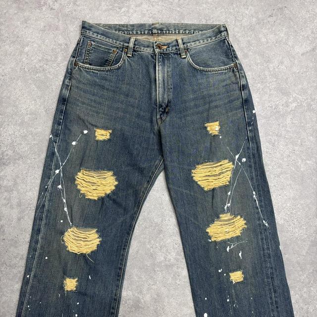 Distressed painted washed jeans