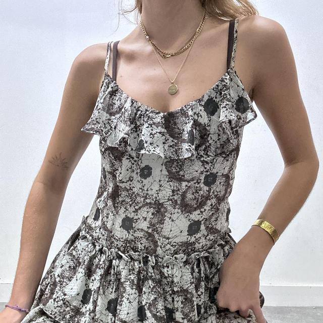 Distressed print ruffle mini dress