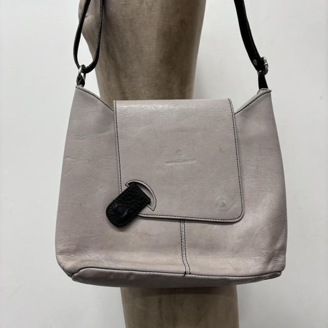 Asymmetrical leather cross-body bag