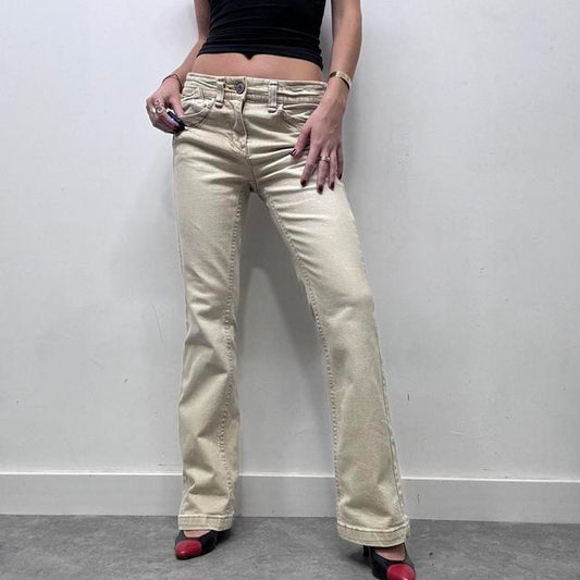 Cream flared distressed trousers