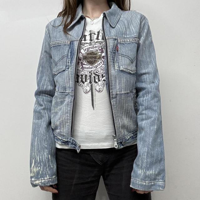 Distressed patched denim jacket