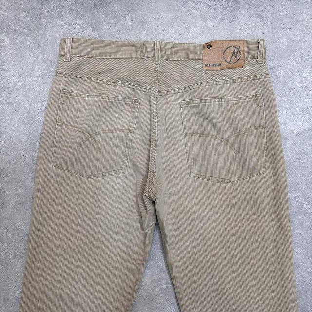 Distressed wash beige jeans