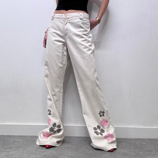 Flared beige wide leg printed trousers