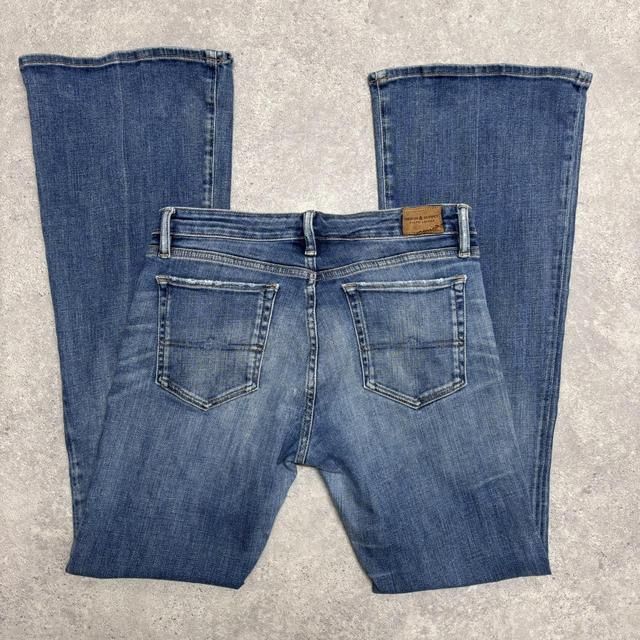 Flared distressed denim jeans