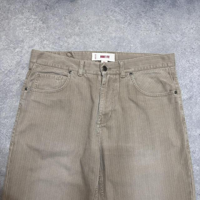 Distressed wash beige jeans
