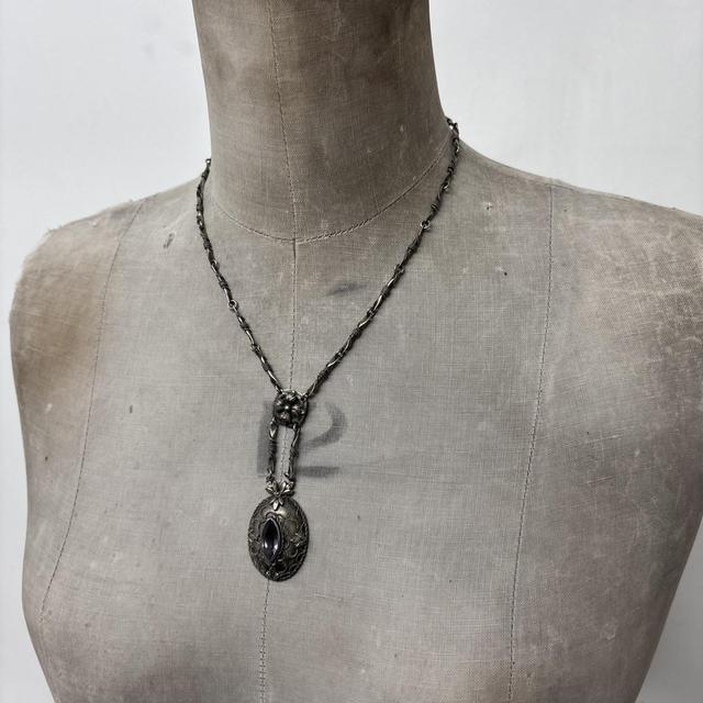 Ornate silver gemstone necklace