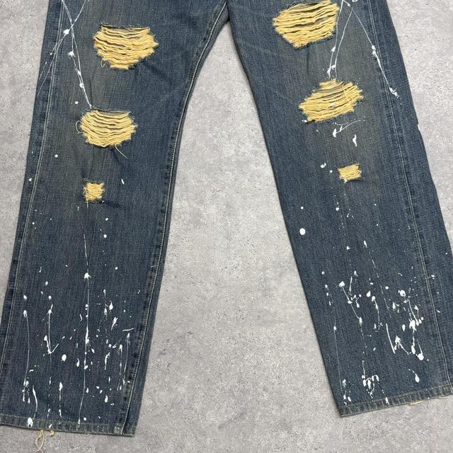 Distressed painted washed jeans