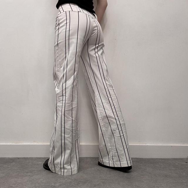 White pinstripe flared suit pants