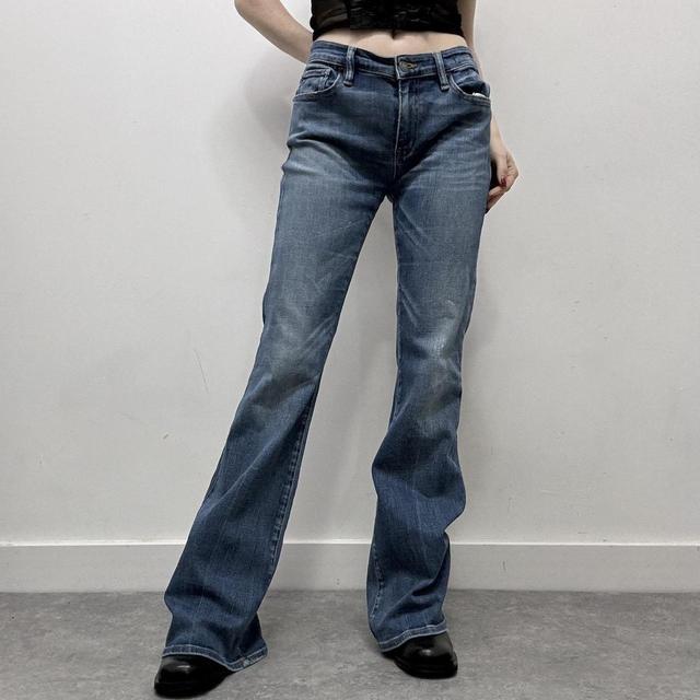 Flared distressed denim jeans