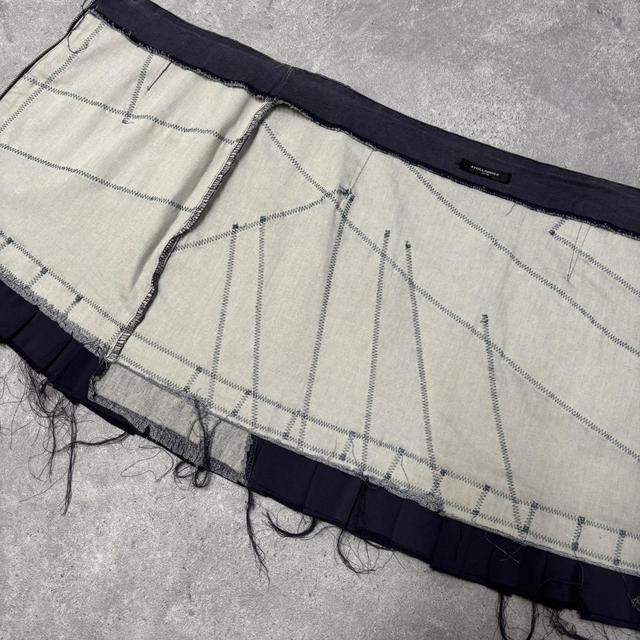 Distressed grunge pleated denim mini skirt