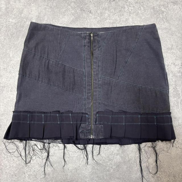 Distressed grunge pleated denim mini skirt