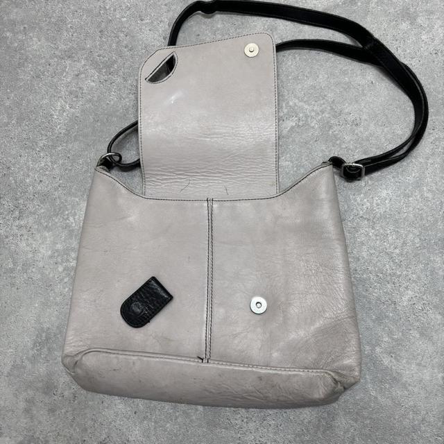 Asymmetrical leather cross-body bag