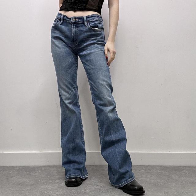Flared distressed denim jeans
