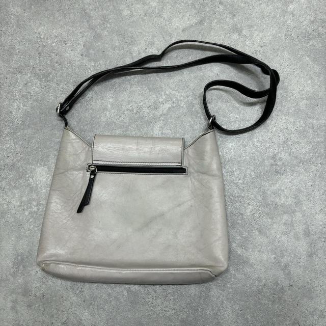 Asymmetrical leather cross-body bag