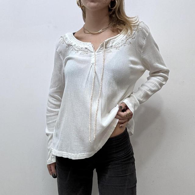 White embroidered flared cheesecloth shirt