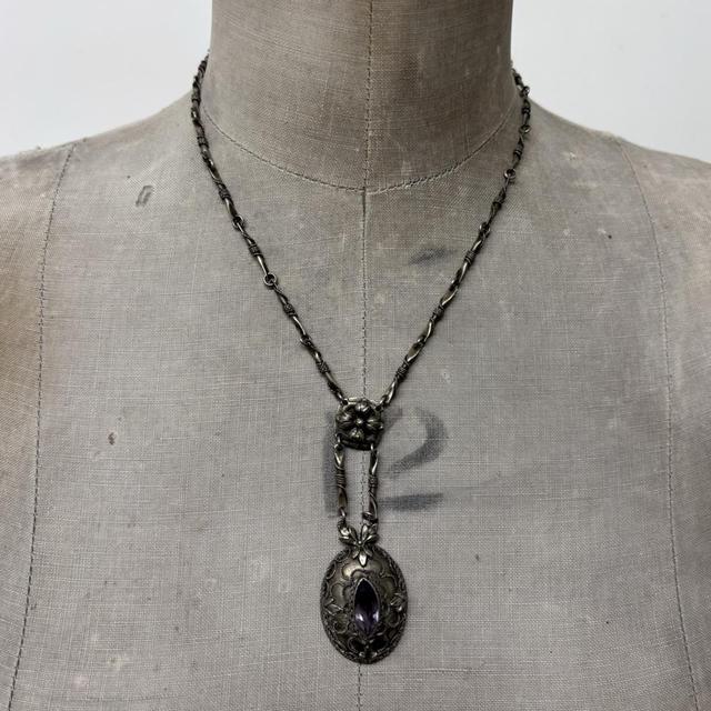 Ornate silver gemstone necklace