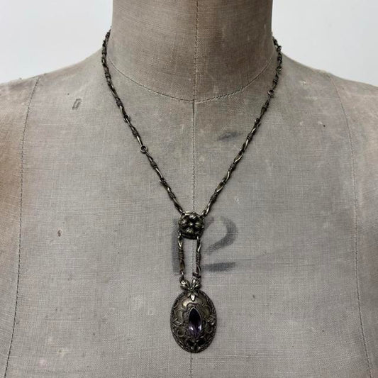Ornate silver gemstone necklace