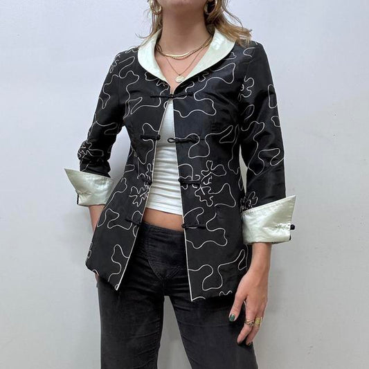 Flared emboidered silk jacket