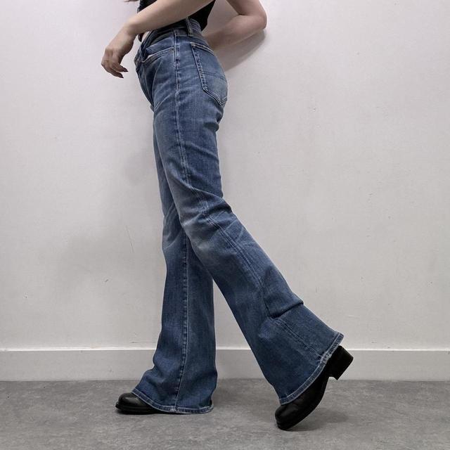 Flared distressed denim jeans