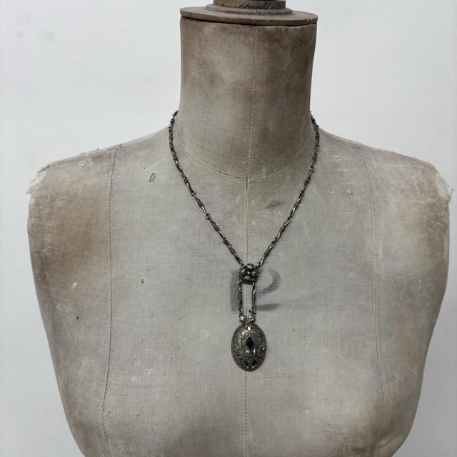 Ornate silver gemstone necklace