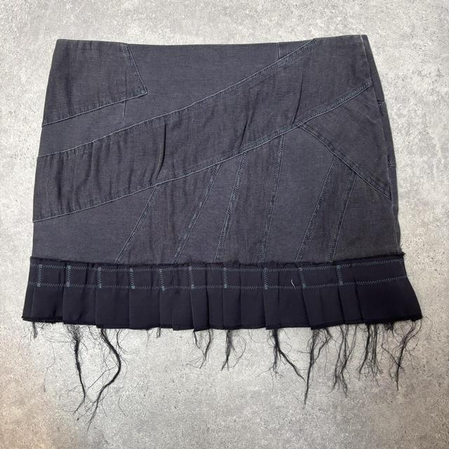 Distressed grunge pleated denim mini skirt