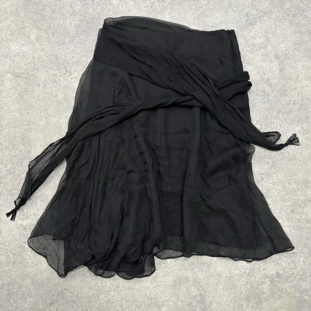 Sheer black asymmetric flutter skirt