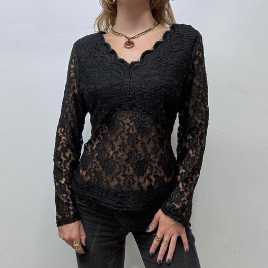 Sheer black lace flared top