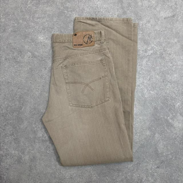 Distressed wash beige jeans