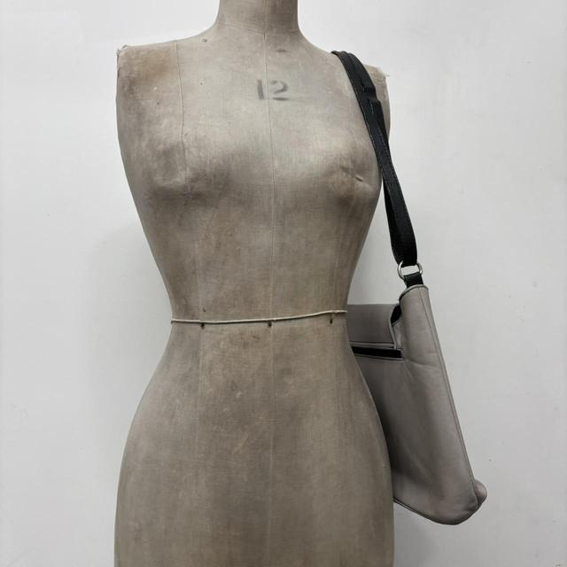 Asymmetrical leather cross-body bag