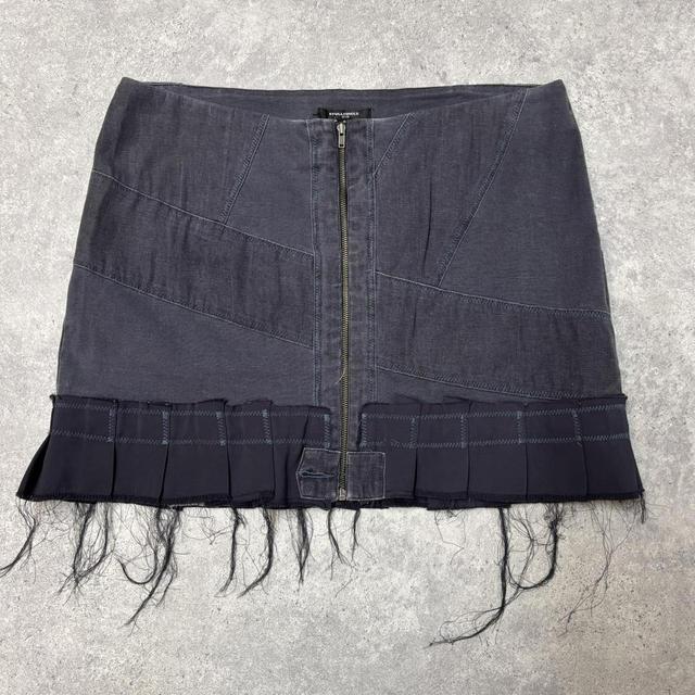 Distressed grunge pleated denim mini skirt