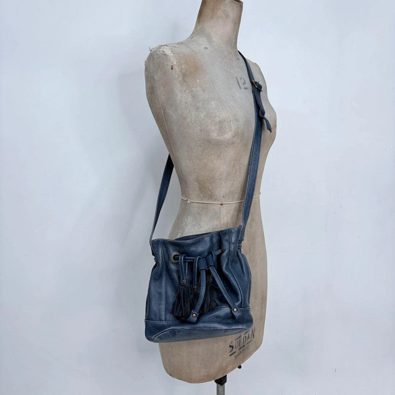navy blue tassle bucket bag