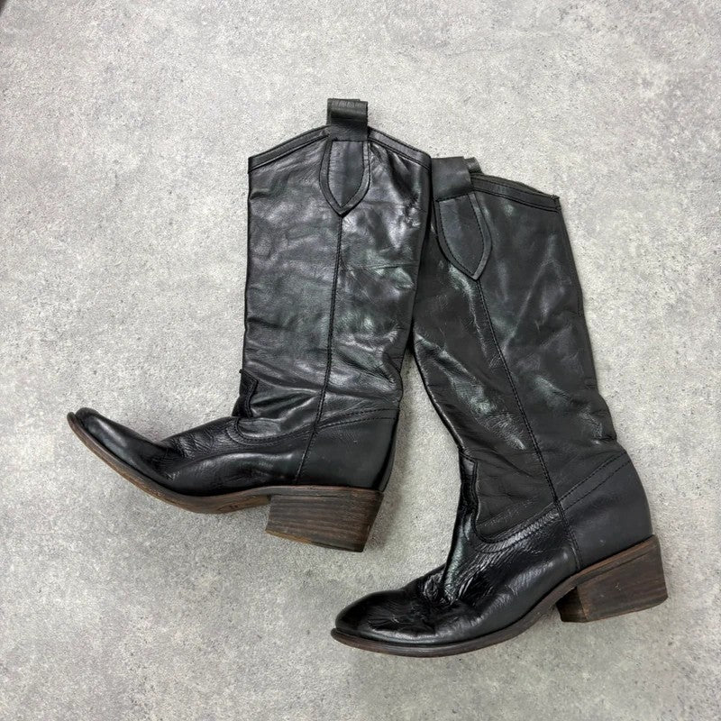 Black leather pointed toe boots