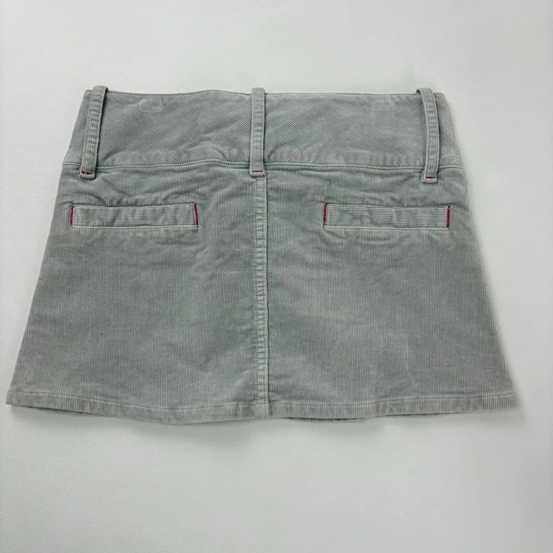 Low rise grey asymmetric mini skirt
