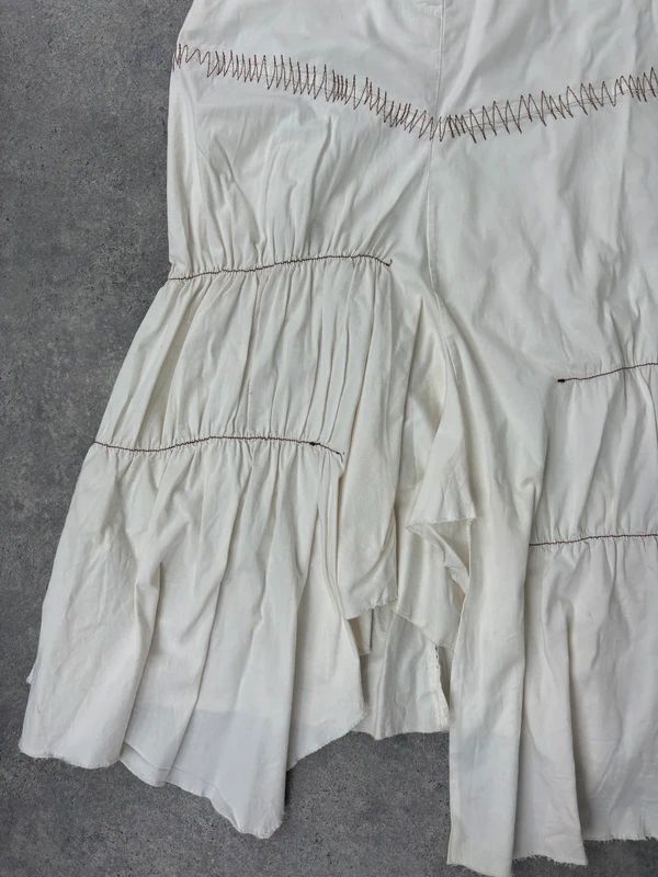 pleated white asymmetric flared maxi skirt