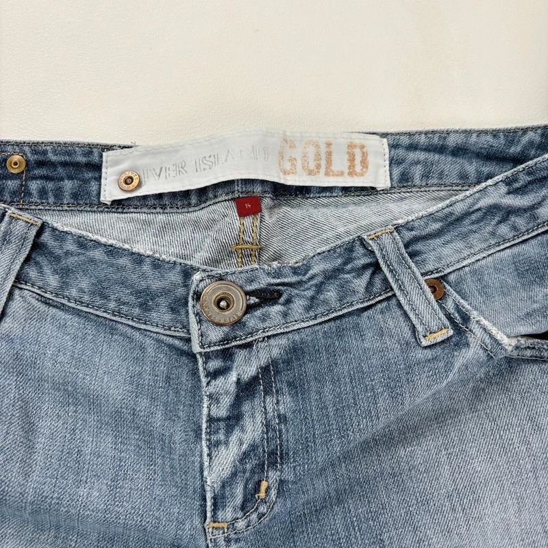 distressed flared leg low rise jeans