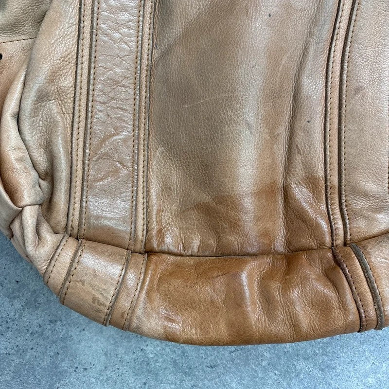Tan distressed leather zip city crossbody D-ring bag