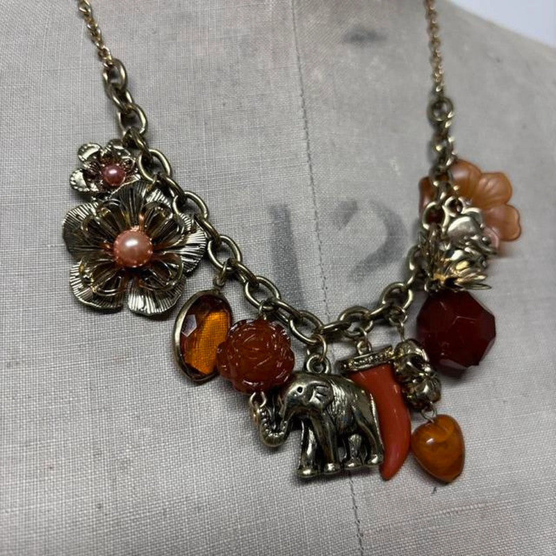 Gold flower elephant charm necklace