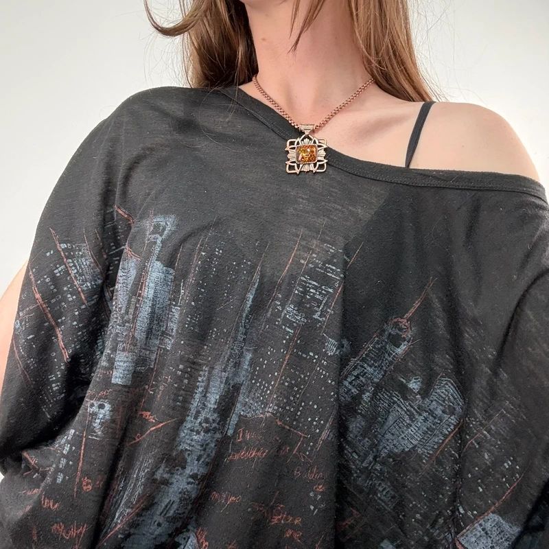 black graphic slouchy off the shoulder t-shirt