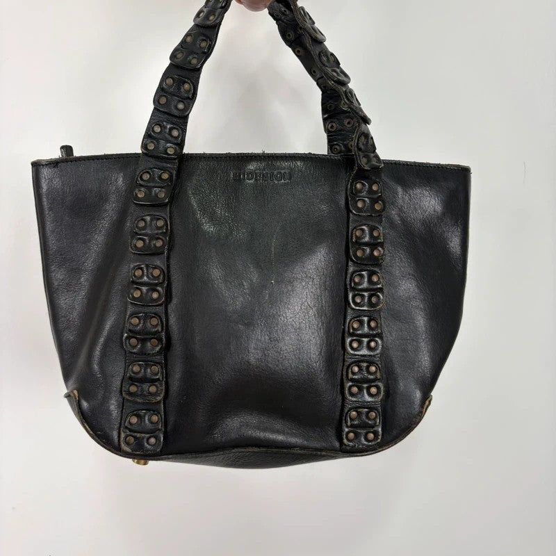 Black mini handbag with studded patchwork handle.