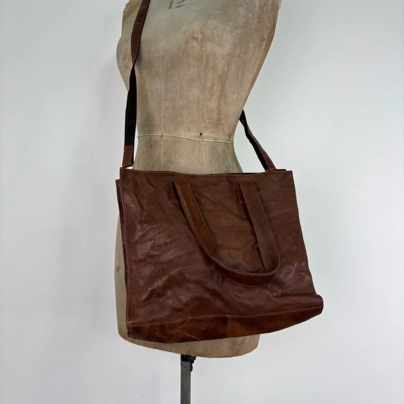 Distressed vintage brown leather handbag