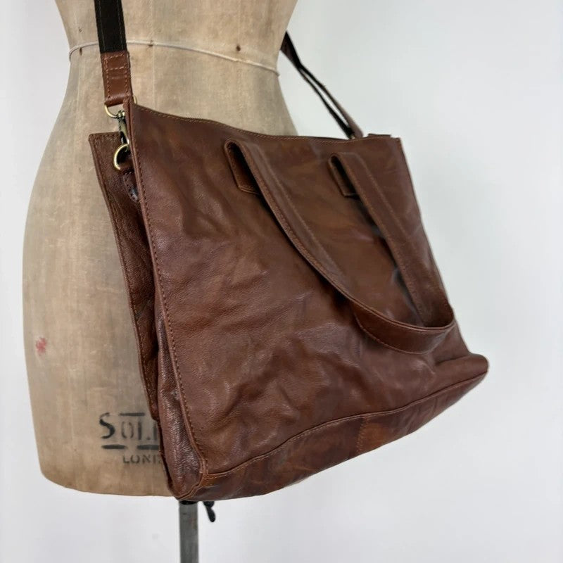 Distressed vintage brown leather handbag