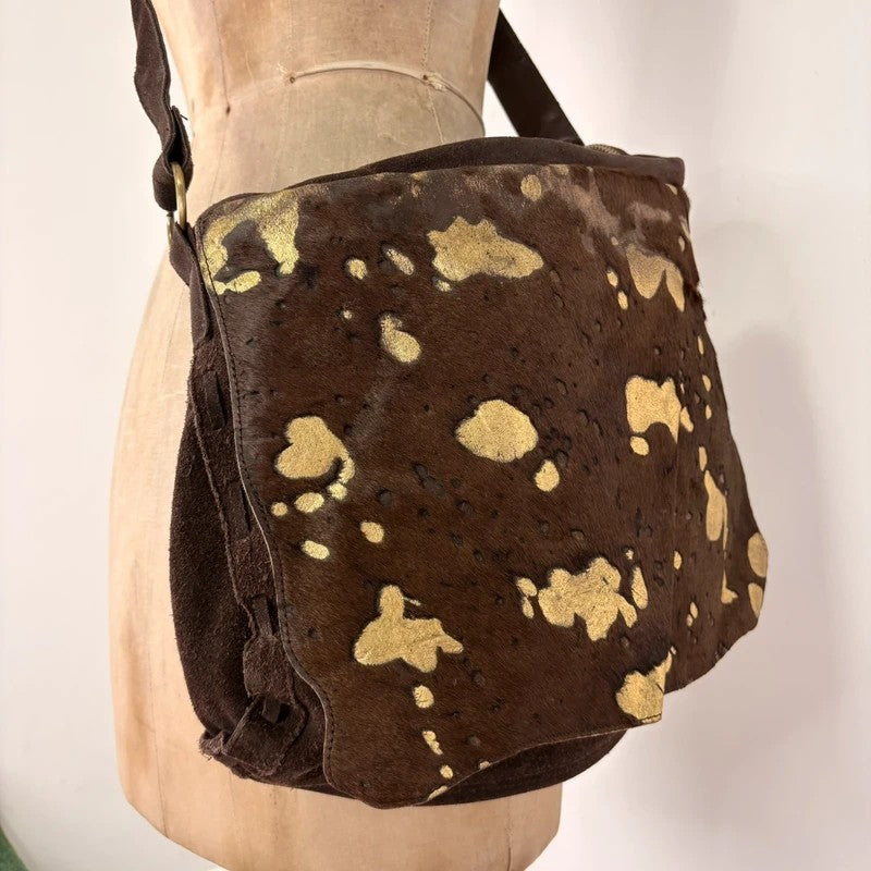 Brown cow hide leather satchel bag with gold embellishment