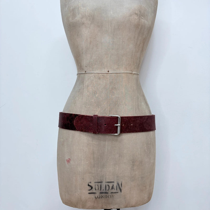 Distressed burgundy red leather belt