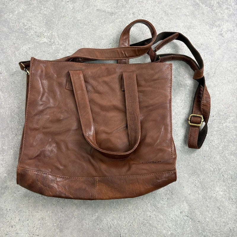Distressed vintage brown leather handbag