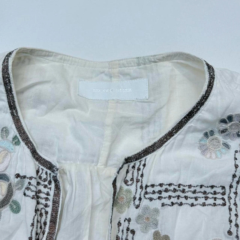 white embroidered flared puff sleeve shirt