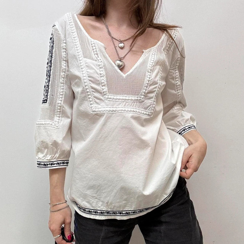 white crochet shirt with navy embroidery