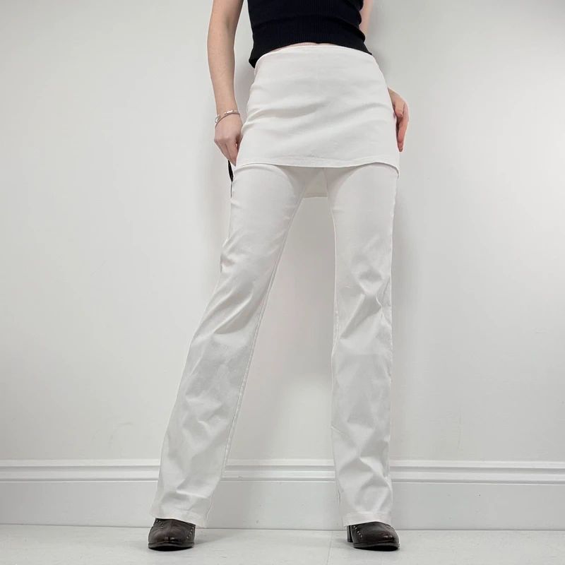 Layered flared trousers with mini skirt overlay