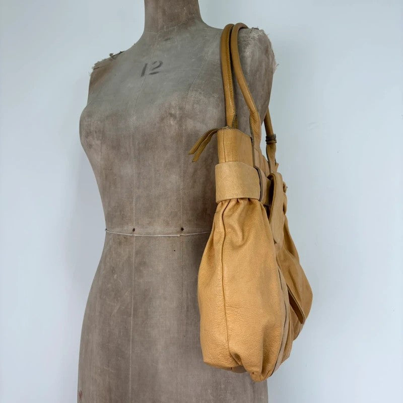 Cream yellow leather knot pleated handbag