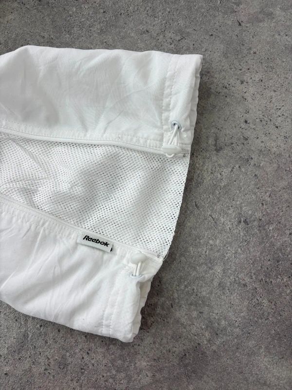 low rise white Reebok tracksuit bottoms