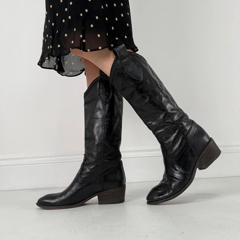 Black leather pointed toe boots